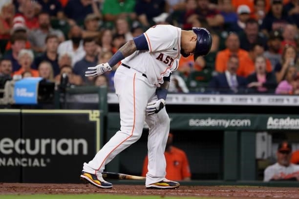 Martin Maldonado of the Houston Astros is hit by a pitch from Travis Lakins Sr. #70 of the Baltimore Orioles during the second inning at Minute Maid...