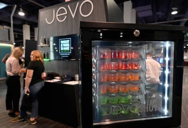 Guests are seen at the Jevo booth during Day 2 of the 35th Annual Nightclub & Bar Show and World Tea Expo at the Las Vegas Convention Center on June...