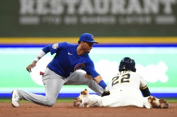 Christian Yelich of the Milwaukee Brewers steals second base against Sergio Alcantara of the Chicago Cubs in the fourth inning at American Family...