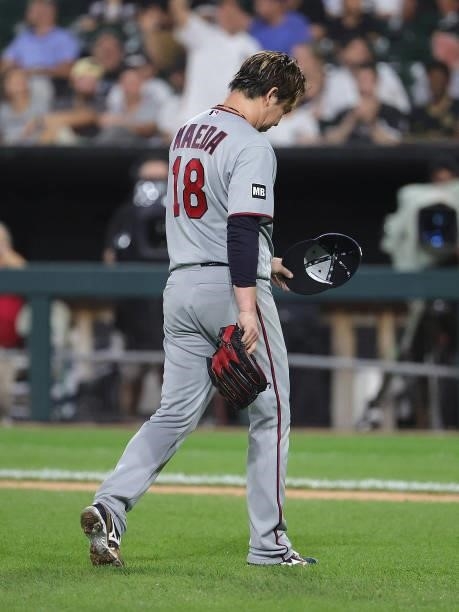 Starting pitcher Kenta Maeda of the Minnesota Twins walks to the dugout after being taken out of the game against the Chicago White Sox in the 5th...