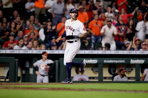 Carlos Correa of the Houston Astros scores on a single hit by Abraham Toro during the fifth inning against the Baltimore Orioles at Minute Maid Park...
