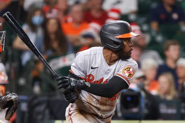 Maikel Franco of the Baltimore Orioles hits an RBI double during the seventh inning against the Houston Astros at Minute Maid Park on June 29, 2021...
