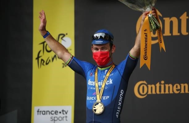 Stage winner Mark Cavendish of Great Britain and Deceuninck - Quick Step celebrates his victory during the podium ceremony of stage 4 of the 108th...