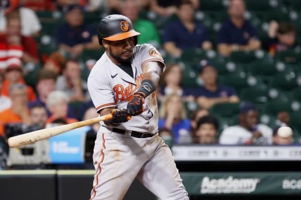 Maikel Franco of the Baltimore Orioles doubles scoring three during the eighth inning against pitcher Ryne Stanek of the Houston Astros at Minute...
