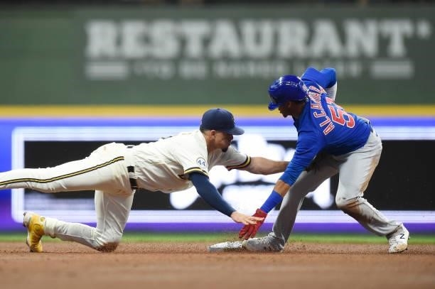 Sergio Alcantara of the Chicago Cubs steals second base against Willy Adames of the Milwaukee Brewers in the third inning at American Family Field on...