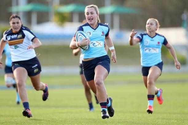Arabella McKenzie of the Waratahs scores a try during the round three Super W match between the NSW Waratahs and the ACT Brumbies at Coffs Harbour...