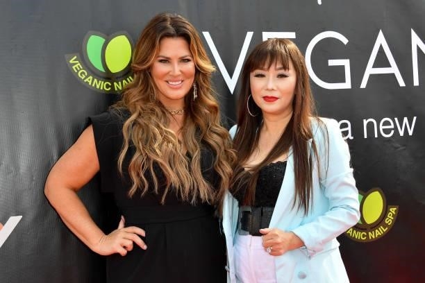 Emily Moore Simpson and Dr. Sam Nguyen attend the Grand Opening of Veganic Nail Spa on June 29, 2021 in Costa Mesa, California.