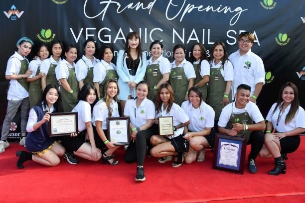 Dr. Sam Nguyen poses for a picture with employees during a Grand Opening of Veganic Nail Spa at Veganic Nail Spa on June 29, 2021 in Costa Mesa,...
