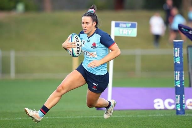 Maya Stewart of the Waratahs scores a try during the round three Super W match between the NSW Waratahs and the ACT Brumbies at Coffs Harbour...