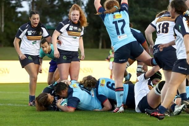 Eva Karpani of the Waratahs scores a try during the round three Super W match between the NSW Waratahs and the ACT Brumbies at Coffs Harbour...