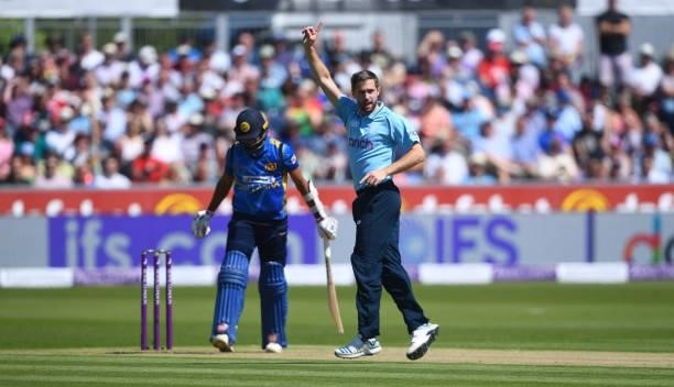 Chris Woakes of England celebrates after getting Dasun Shanaka of Sri Lanka out during the 1st One Day International match between England and Sri...