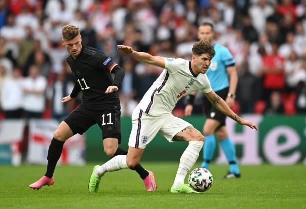 John Stones of England is closed down by Timo Werner of Germany during the UEFA Euro 2020 Championship Round of 16 match between England and Germany...