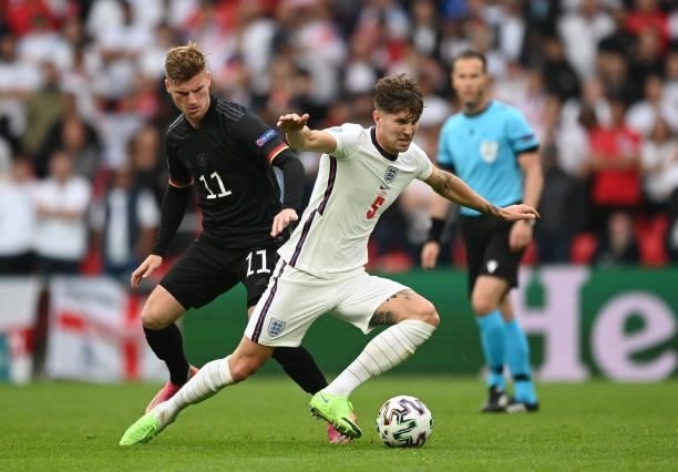 John Stones of England is closed down by Timo Werner of Germany during the UEFA Euro 2020 Championship Round of 16 match between England and Germany...