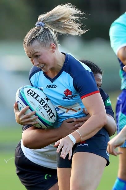 Layne Morgan of the Waratahs runs with the ball during the round three Super W match between the NSW Waratahs and the ACT Brumbies at Coffs Harbour...