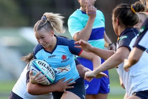 Layne Morgan of the Waratahs runs with the ball during the round three Super W match between the NSW Waratahs and the ACT Brumbies at Coffs Harbour...