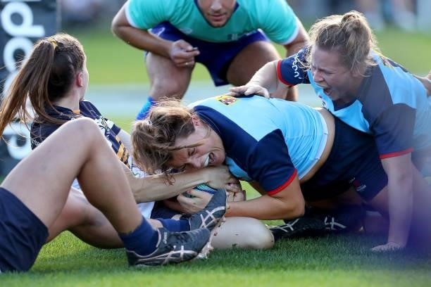 Grace Hamilton of the Waratahs attempts to score during the round three Super W match between the NSW Waratahs and the ACT Brumbies at Coffs Harbour...