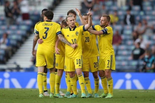 Emil Forsberg of Sweden celebrates scoring their opening goal with his team mates during the UEFA Euro 2020 Championship Round of 16 match between...