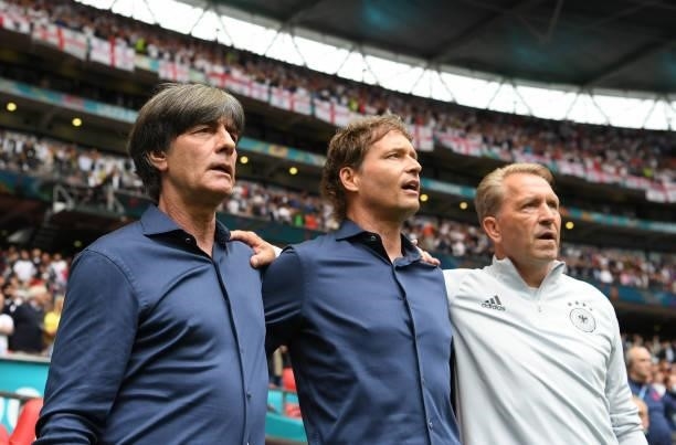 Joachim Loew, Head Coach of Germany, Marcus Sorg, Assistant Coach of Germany and Andreas Kopke, Goalkeeping Coach of Germany stand for the national...