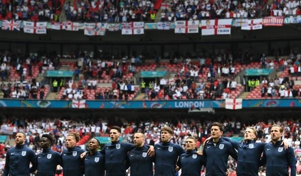 Players of England stand for the national anthem prior to the UEFA Euro 2020 Championship Round of 16 match between England and Germany at Wembley...