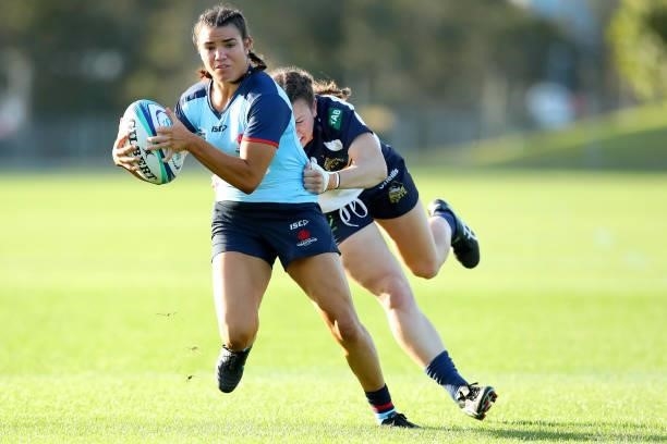 Margot Vella of the Waratahs runs with the ball while being is tackled by Claudia Obst of the Brumbies during the round three Super W match between...