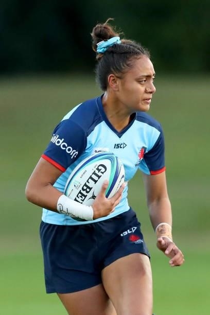 Georgina Tuipulotu of the Waratahs runs with the ball during the round three Super W match between the NSW Waratahs and the ACT Brumbies at Coffs...