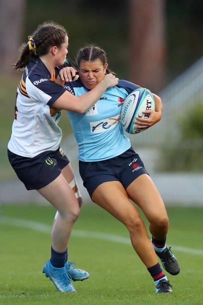 Margot Vella of the Waratahs runs with the ball during the round three Super W match between the NSW Waratahs and the ACT Brumbies at Coffs Harbour...