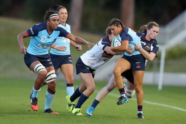 Emily Chancellor of the Waratahs tackles Margot Vella of the Waratahs during the round three Super W match between the NSW Waratahs and the ACT...