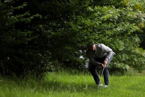 Rory McIlroy of Northern Ireland plays out from a bush as he participates in the pro am during a practice day prior to The Dubai Duty Free Irish Open...