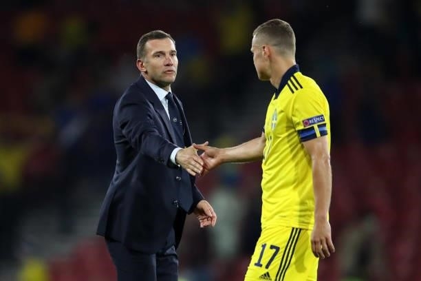 Ukriane manager Andriy Shevchenko shakes hands with Viktor Claesson of Sweden following the UEFA Euro 2020 Championship Round of 16 match between...