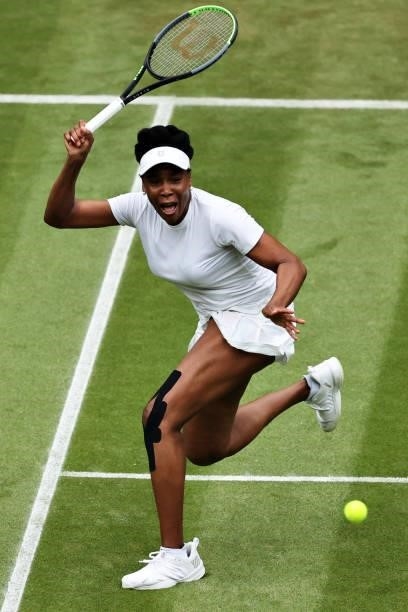 Venus Williams of The United States plays a forehand in her Ladies' Singles Second Round match against Ons Jabeur of Tunisia during Day Three of The...