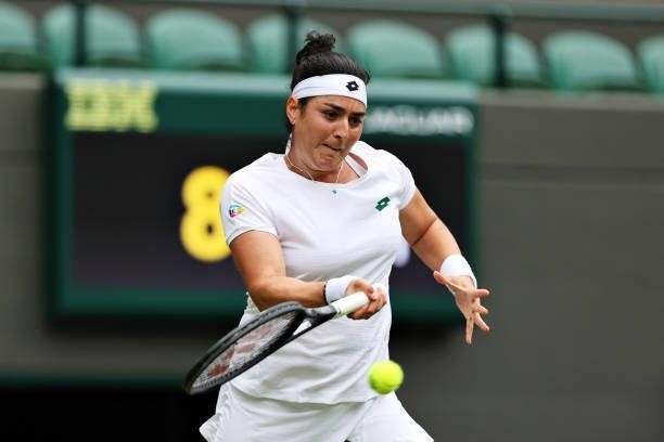 Ons Jabeur of Tunisia plays a forehand in her Ladies' Singles Second Round match against Venus Williams of The United States during Day Three of The...