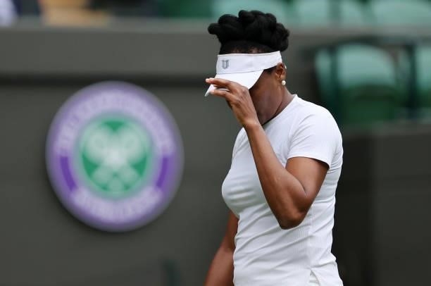 Venus Williams of The United States reacts in her Ladies' Singles Second Round match against Ons Jabeur of Tunisia during Day Three of The...
