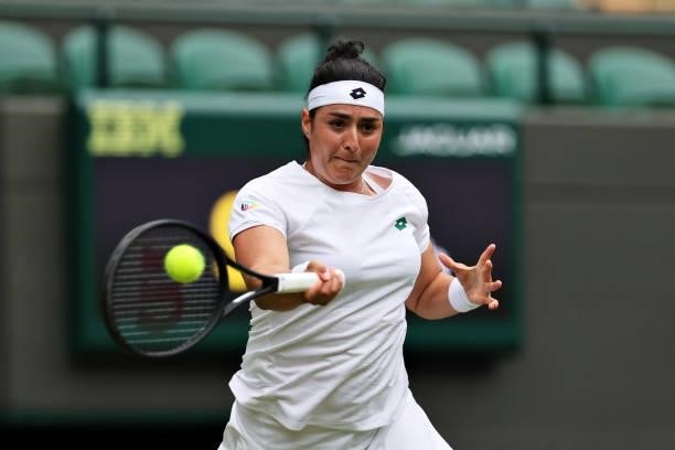 Ons Jabeur of Tunisia plays a forehand in her Ladies' Singles Second Round match against Venus Williams of The United States during Day Three of The...