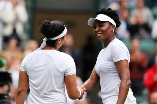 Venus Williams of The United States and Ons Jabeur of Tunisia shake hands at the net after their Ladies' Singles Second Round match during Day Three...