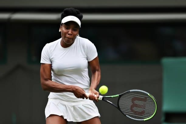 Venus Williams of The United States plays a backhand in her Ladies' Singles Second Round match against Ons Jabeur of Tunisia during Day Three of The...