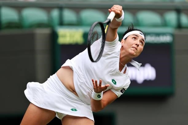 Ons Jabeur of Tunisia serves in her Ladies' Singles Second Round match against Venus Williams of The United States during Day Three of The...