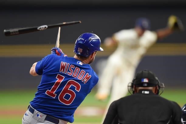 Patrick Wisdom of the Chicago Cubs breaks his bat on an two-run RBI single in the first inning against the Milwaukee Brewers at American Family Field...