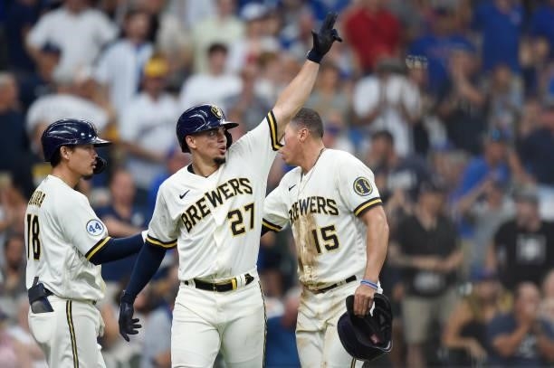 Willy Adames of the Milwaukee Brewers celebrates after scoring a run on a two-run RBI single by Jace Peterson in the fourth inning against the...