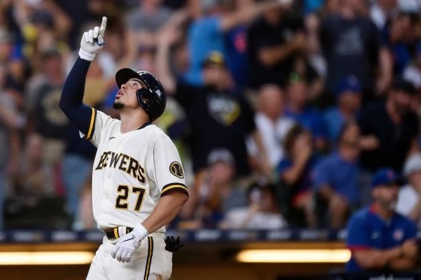 Willy Adames of the Milwaukee Brewers celebrates after hitting a grand slam against the Chicago Cubs in the fourth inning at American Family Field on...
