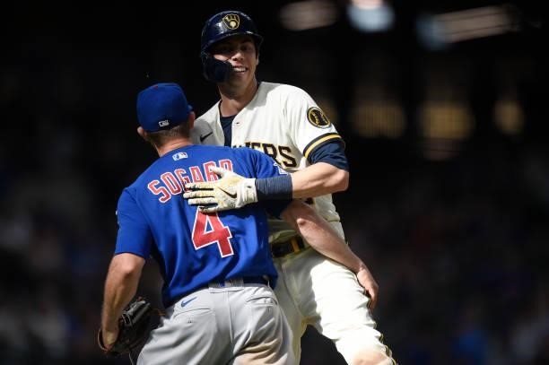 Eric Sogard of the Chicago Cubs reacts as he tags out Christian Yelich of the Milwaukee Brewers on a ground ball to end the bottom of the eighth...