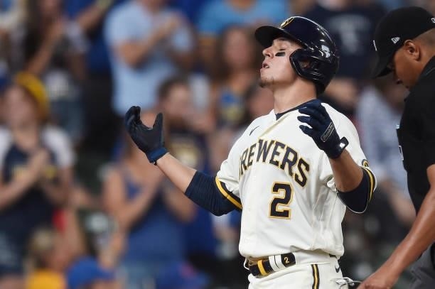 Luis Urias of the Milwaukee Brewers celebrates after hitting a two-run home run against the Chicago Cubs in the second inning at American Family...