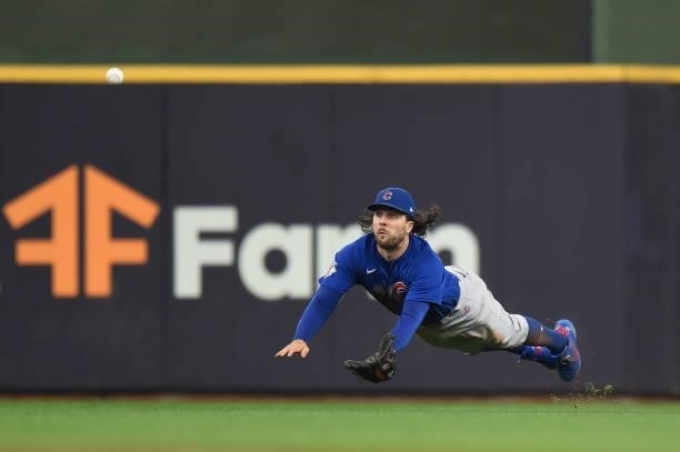 Jake Marisnick of the Chicago Cubs is unable to catch a single by Jace Peterson of the Milwaukee Brewers in the second inning at American Family...