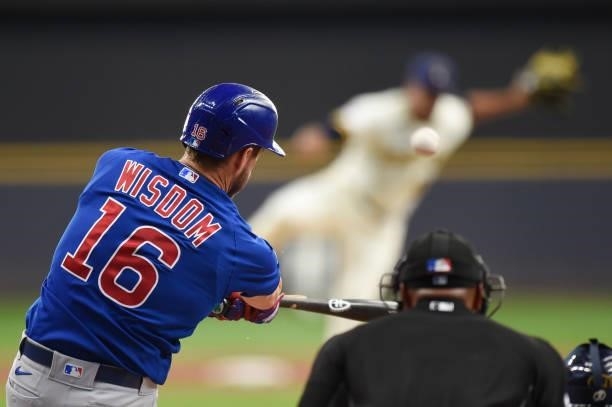 Patrick Wisdom of the Chicago Cubs breaks his bat on an two-run RBI single in the first inning against the Milwaukee Brewers at American Family Field...