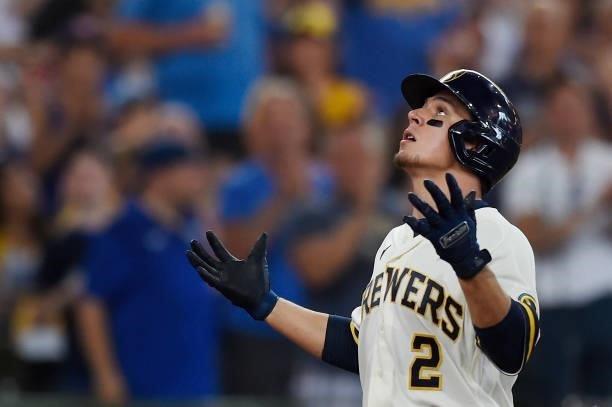 Luis Urias of the Milwaukee Brewers celebrates after hitting a solo home run against the Chicago Cubs in the sixth inning at American Family Field on...