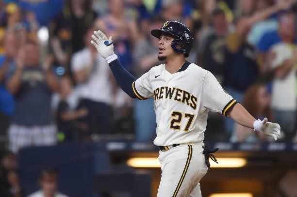 Willy Adames of the Milwaukee Brewers celebrates after hitting a grand slam against the Chicago Cubs in the fourth inning at American Family Field on...