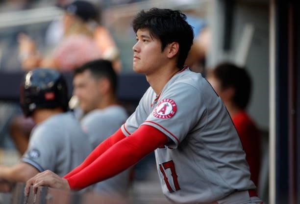 Shohei Ohtani of the Los Angeles Angels looks on from the dugout during the first inning against the New York Yankees at Yankee Stadium on June 30,...
