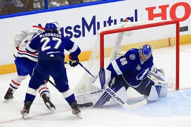 Andrei Vasilevskiy of the Tampa Bay Lightning blocks a shot by Nick Suzuki of the Montreal Canadiens during the first period in Game Two of the 2021...