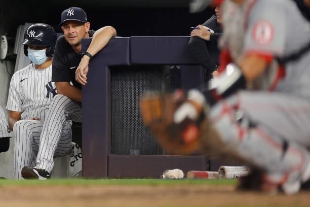 Manager Aaron Boone of the New York Yankees looks on during the third inning against the Los Angeles Angels at Yankee Stadium on June 30, 2021 in the...