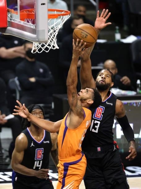 Cameron Payne of the Phoenix Suns goes up for a shot against Paul George of the LA Clippers during the first half in Game Six of the Western...