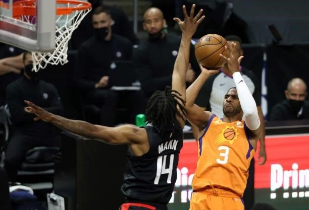 Chris Paul of the Phoenix Suns goes up for a shot against Terance Mann of the LA Clippers during the first half in Game Six of the Western Conference...